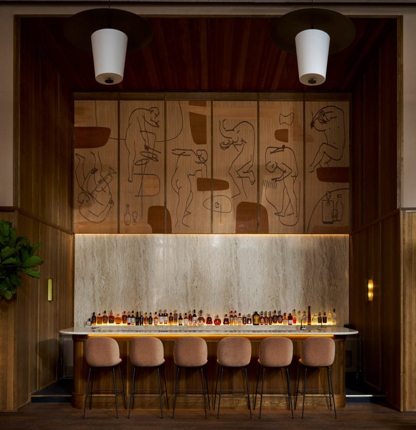 Dancing figures on wooden wall