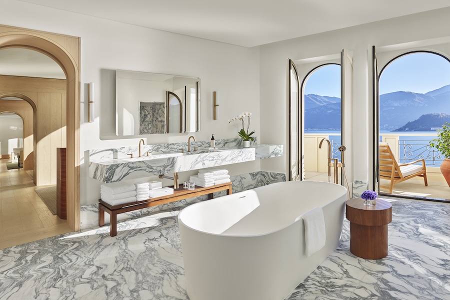 The Lake Como EDITION Cadenabbia Italy restored 19th century palazzo neri&hu de.tales arched windows mountain lake view freestanding bathtub bathroom double sink vanity marble